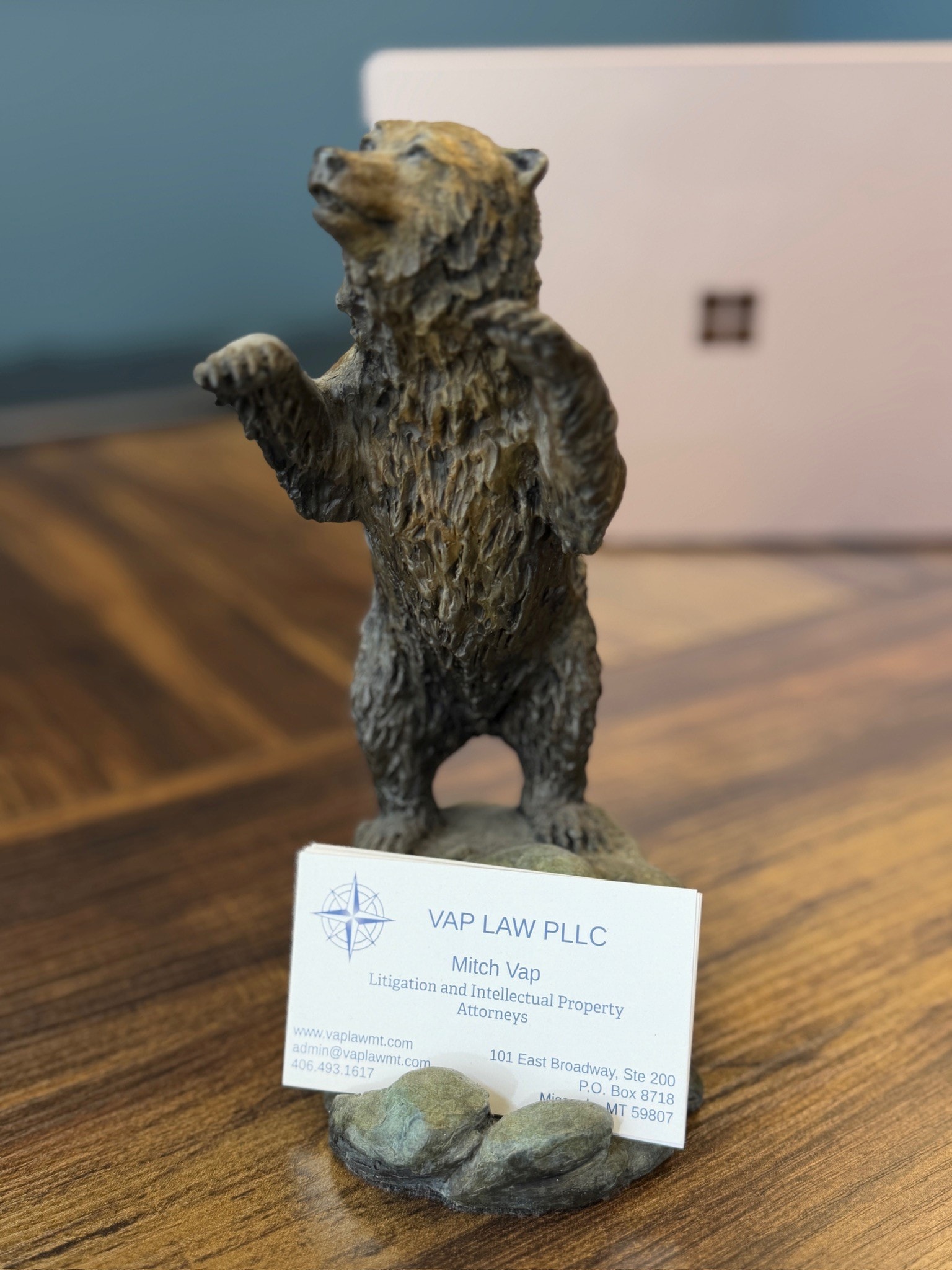 Vap Law PLLC business card in a Montana grizzly bear card holder — a nod to Big Sky Country